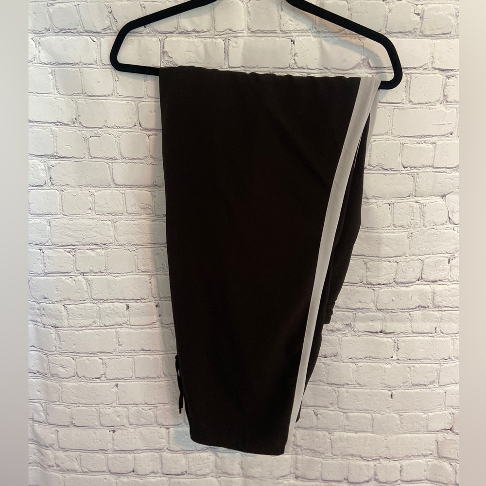 Black pants w/light gray stripe along side Dress up w/heels or casual w/sandals.